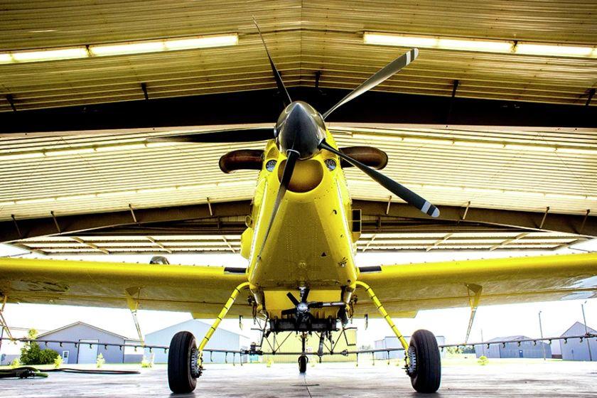 Air Tractor aircraft parked in a hangar.