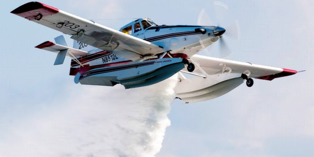 Air Tractor AT-802AF Fire Boss firefighting aircraft performing a water drop on a fire