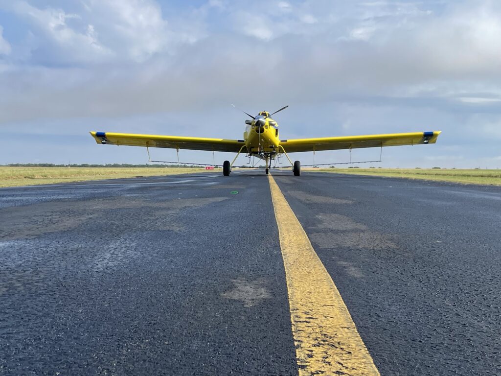 The 5000th Air Tractor agricultural aircraft on the runway, showcasing the AT-502B model, designed for efficient crop spraying and agricultural applications.